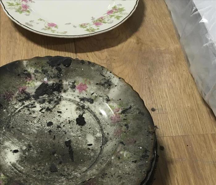 Two plates. One with no damage and one with fire damage.