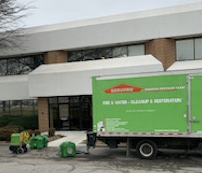 SERVPRO truck parked outside structure. 